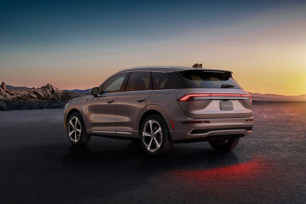 2027 Lincoln Corsair Hybrid rear three-quarter view parked on a desert plain at sunset