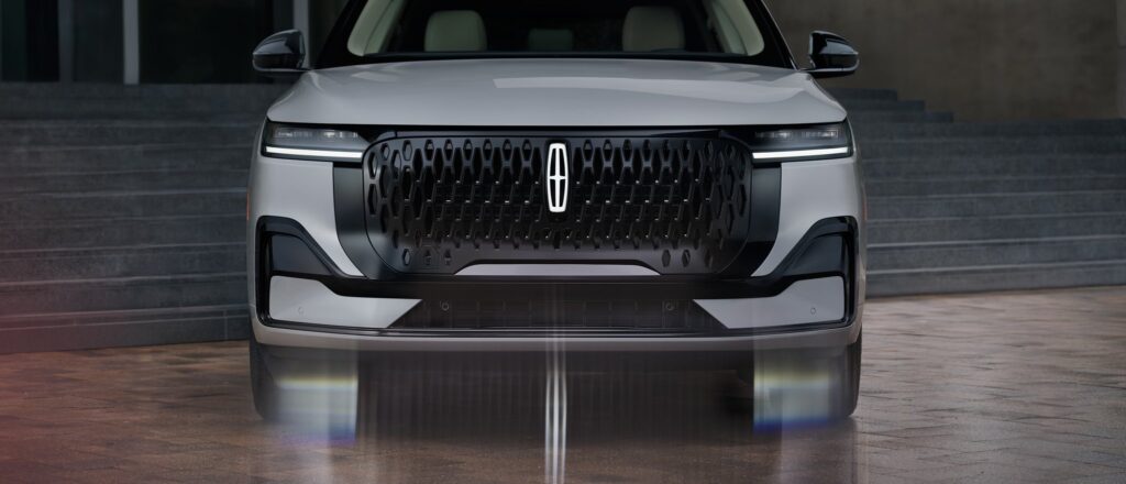 2027 Lincoln Nautilus front view of a silver suv on a brick plaza by stairs